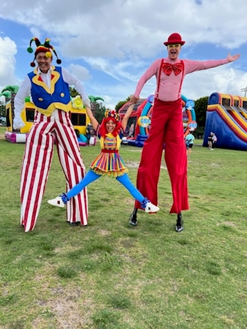 OOOPSY stilt walkers and clown performer at Miami festival